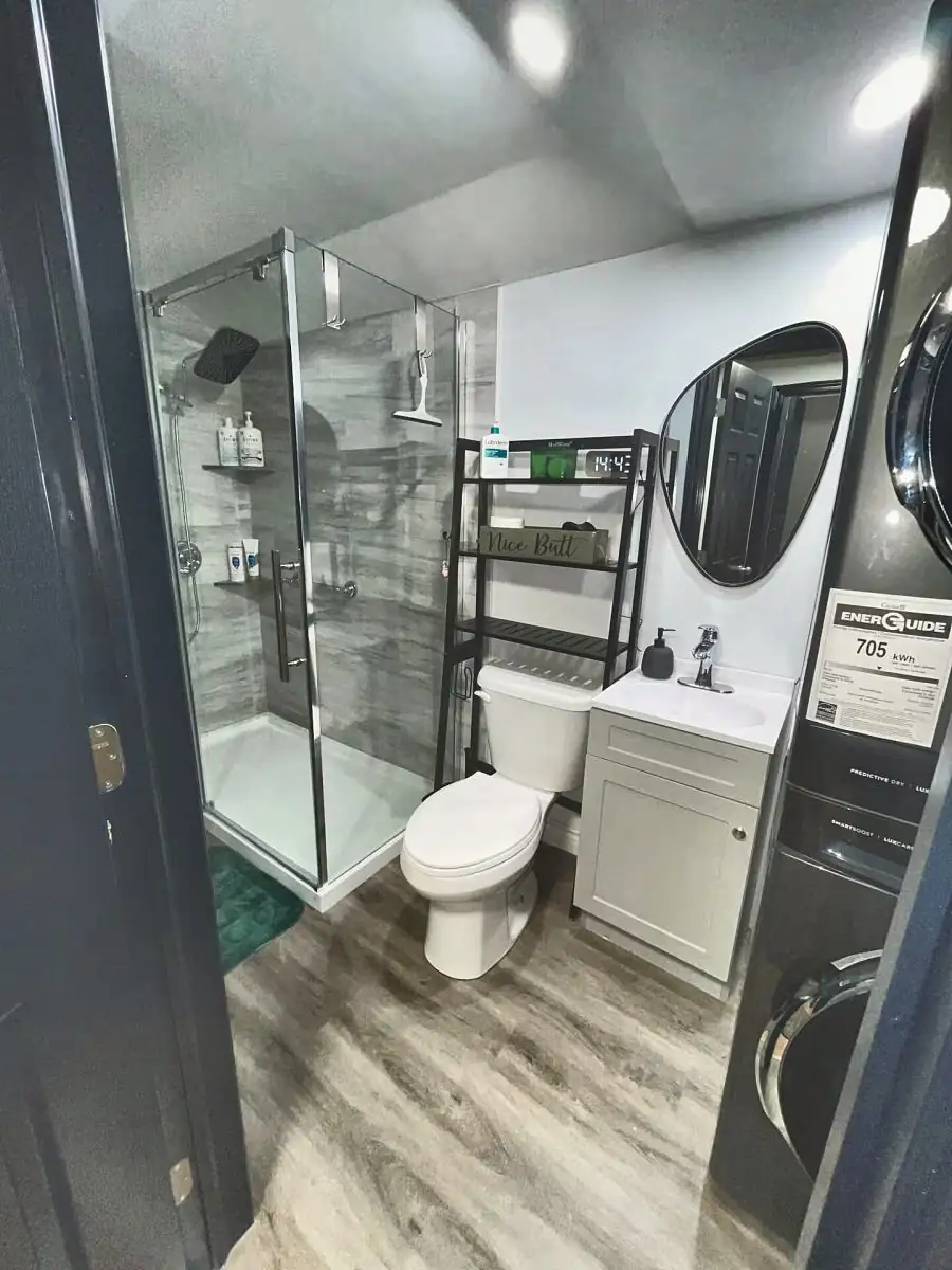 Bathroom in The Bennett Den, with washer and dryer in the unit